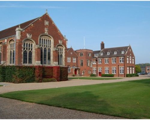 Historic Gresham School buildings surrounded by well-maintained lawns, showcasing the venue for the North Norfolk Tourism Show.
